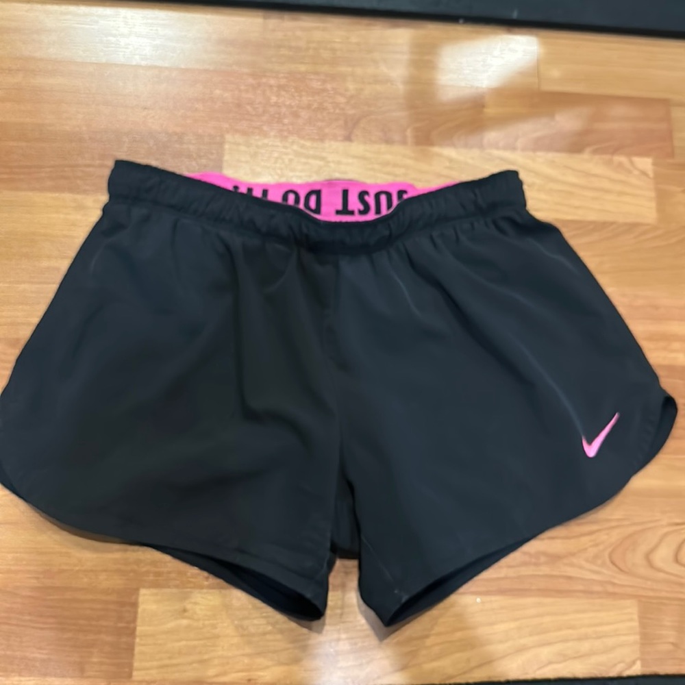 Black and pink Nike track shorts
